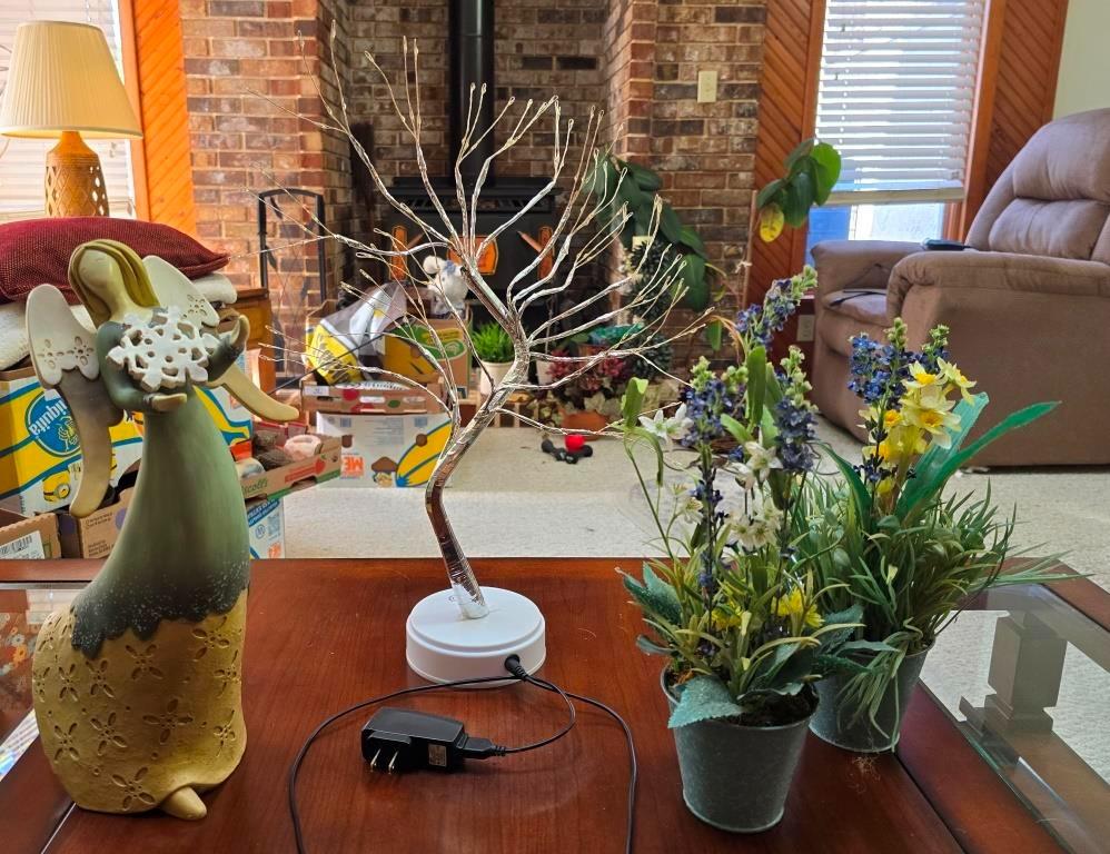 Angel Figurine and Illuminated Tree